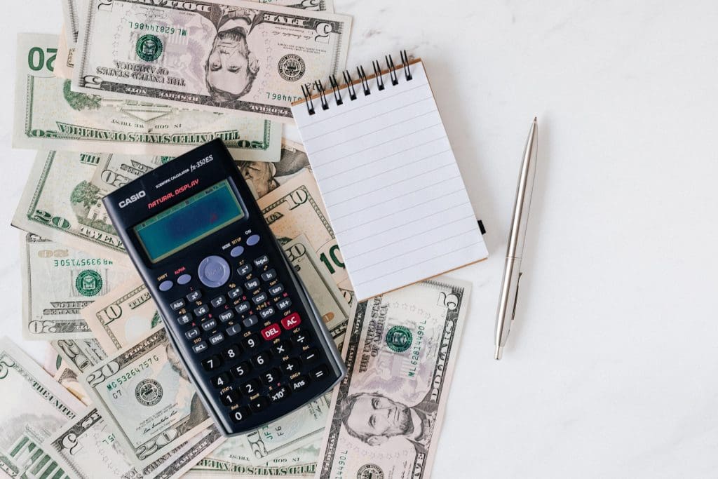 money, calculator, notepad and pen: Blog feature image
