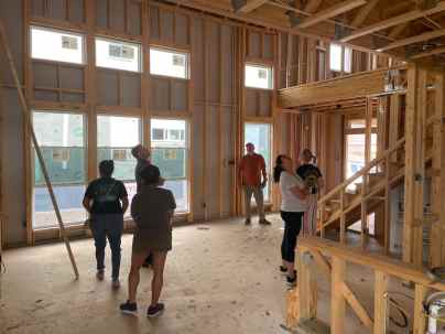 people inside a new build home assessing systems and structures