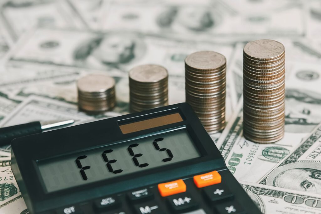 Calculator shows “FEES” with coins and dollar bills in the background, highlighting property management fees.