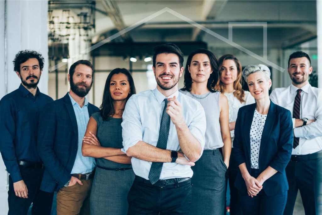 Group of professionals in an office with a house overlay, illustrating if you need a license to manage a rental property.