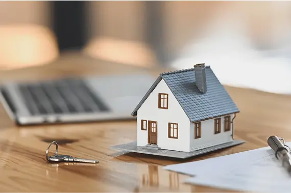 House with Key sitting on a table