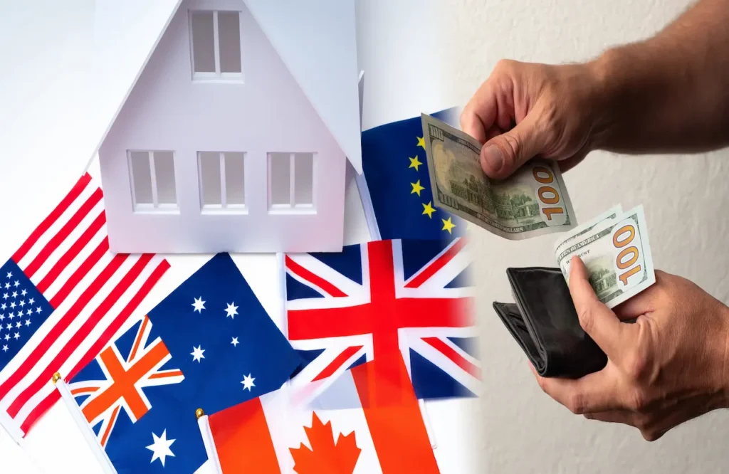 Foreign investor taxes on rental property concept with international flags, a model house, and hands paying with U.S. $100 bills