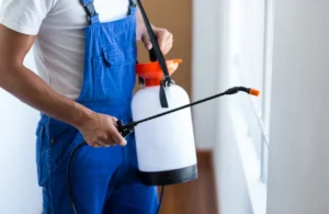 Pest control technician treating a rental property in Texas