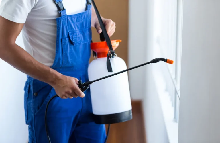 Pest control technician treating a rental property in Texas